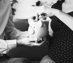 person holding piggy bank
